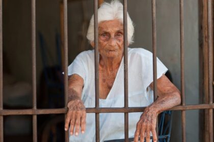 old-woman-trapped-behind-bars-18332287